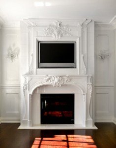 french limestone mantel with TV on top